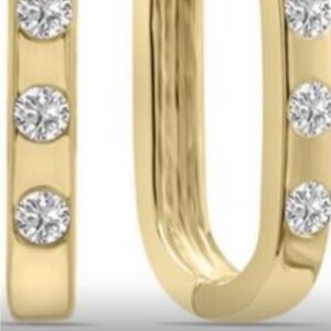 14k gold tiny Huggies lab diamond earrings. Available in 14k white gold as well.